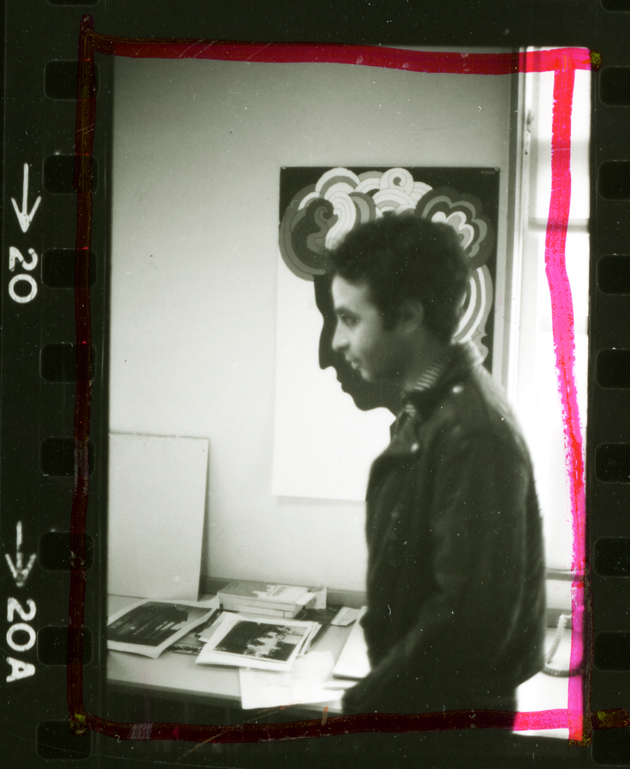 Artist Frank Roth with profile against Glaser Dylan poster